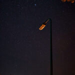 Dark sky with stars and a street lantern that doesn't work